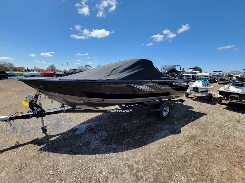 Slide: The Image of 2023 Crestliner 1750 Fish Hawk SE WT boat on trailer under blue sky. - 6