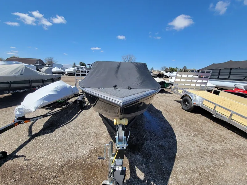 Slide: The Image of 2023 Crestliner 1750 Fish Hawk SE WT boat with cover, parked outdoors under blue sky. - 7