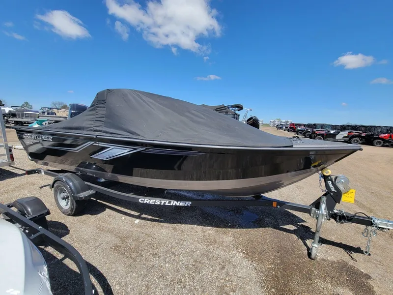 Slide: The Image of 2023 Crestliner 1750 Fish Hawk SE WT boat with cover on trailer, under clear blue sky. - 8