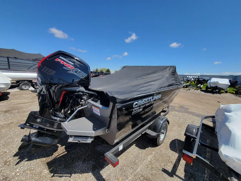 Slide: The Image of 2023 Crestliner 1750 Fish Hawk SE WT boat with Mercury engine, covered and on a trailer. - 9