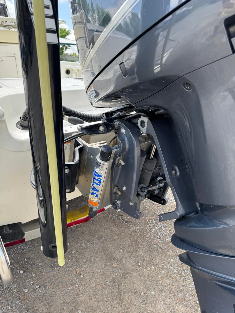 Slide: The Image of 2017 NauticStar 2200 Sport boat engine and propeller detail. - 11