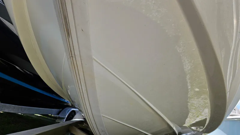 Slide: The Image of 2017 NauticStar 2200 Sport boat hull on trailer, close-up view. - 12