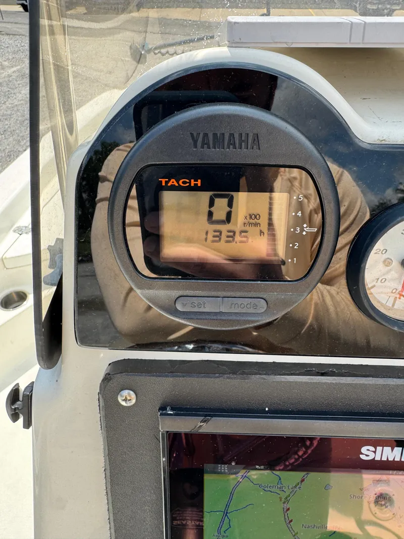 Slide: The Image of Yamaha tachometer on 2017 NauticStar 2200 Sport boat dashboard. - 2