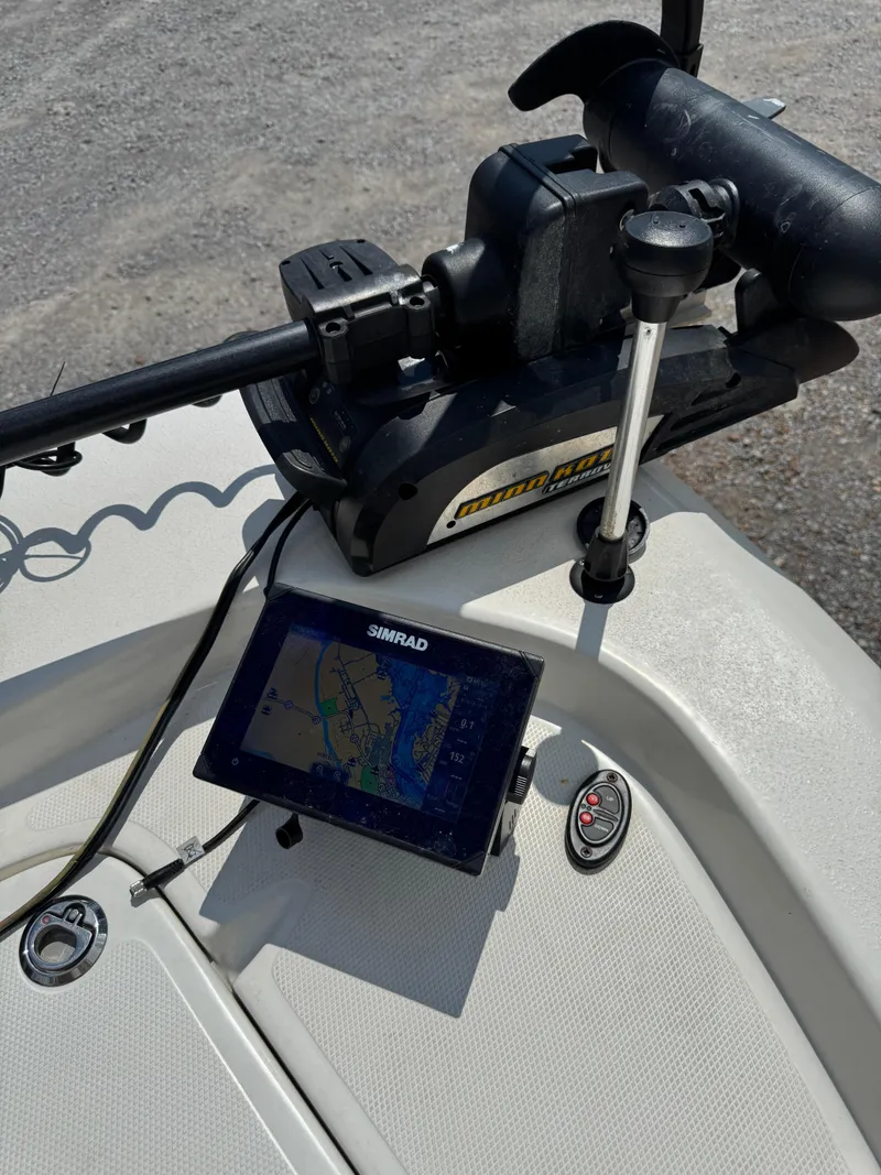 Slide: The Image of 2017 NauticStar 2200 Sport boat with Simrad navigation system and trolling motor. - 3