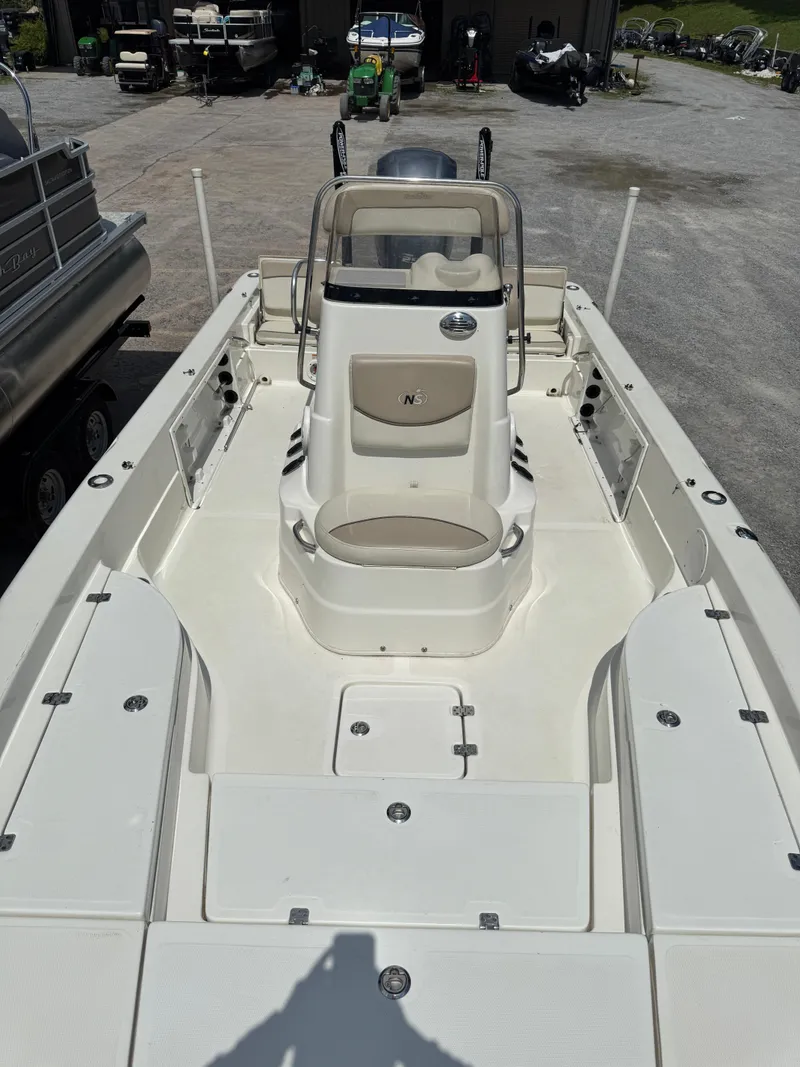 Slide: The Image of 2017 NauticStar 2200 Sport boat interior, featuring spacious seating and modern design. - 5