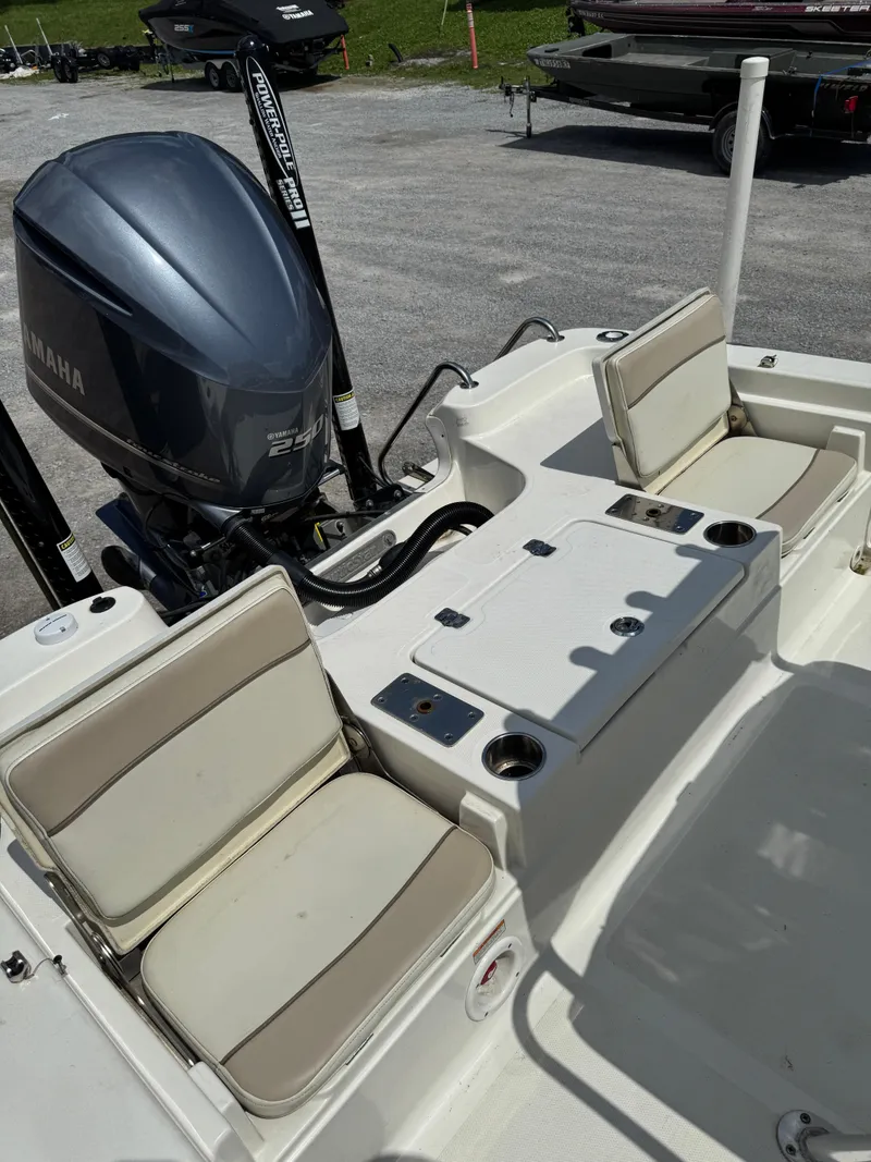 Slide: The Image of 2017 NauticStar 2200 Sport boat interior with Yamaha engine and seating. - 8