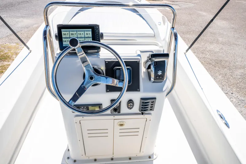 Slide: The Image of 2016 Panga 19 Niente boat console with steering wheel and navigation display. - 18
