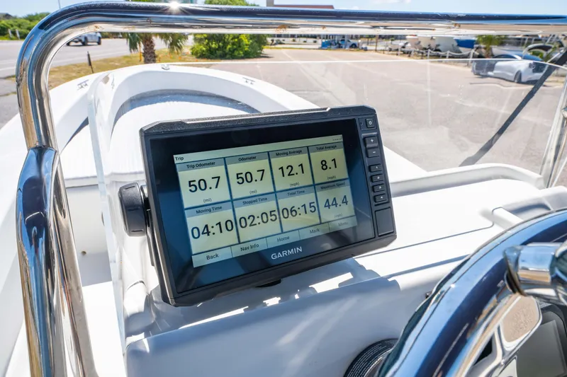 Slide: The Image of Garmin display on 2016 Panga 19 Niente boat dashboard, showing navigation and performance data. - 19
