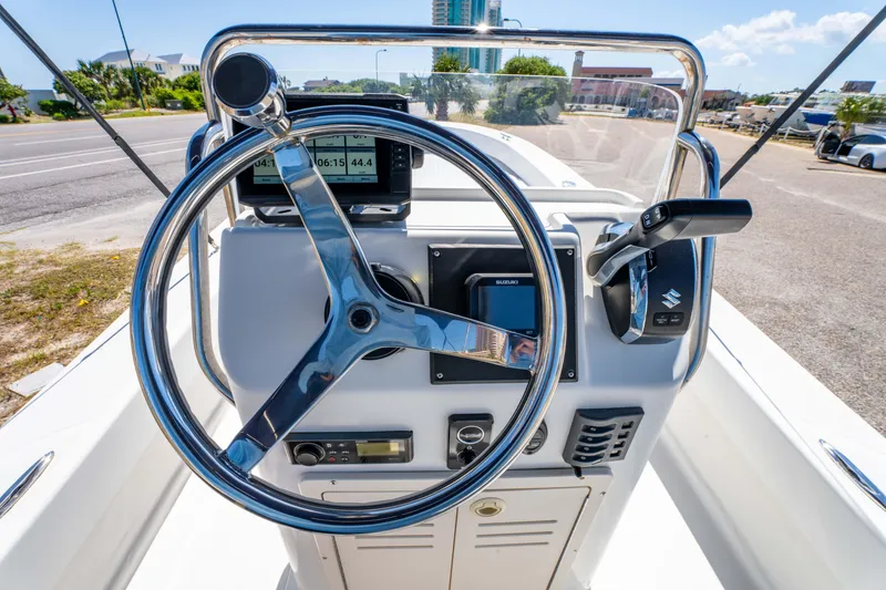 Slide: The Image of Steering console of a 2016 Panga 19 Niente boat with navigation equipment. - 20