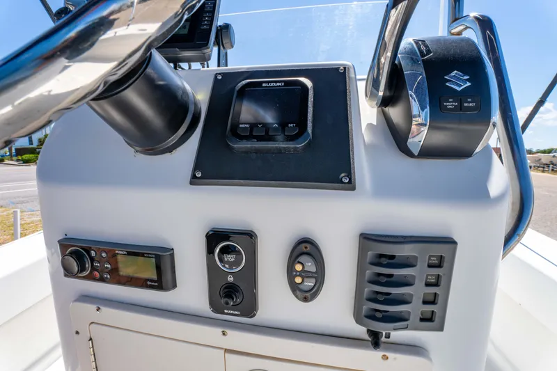 Slide: The Image of Control panel of 2016 Panga 19 Niente boat with navigation and communication equipment. - 21