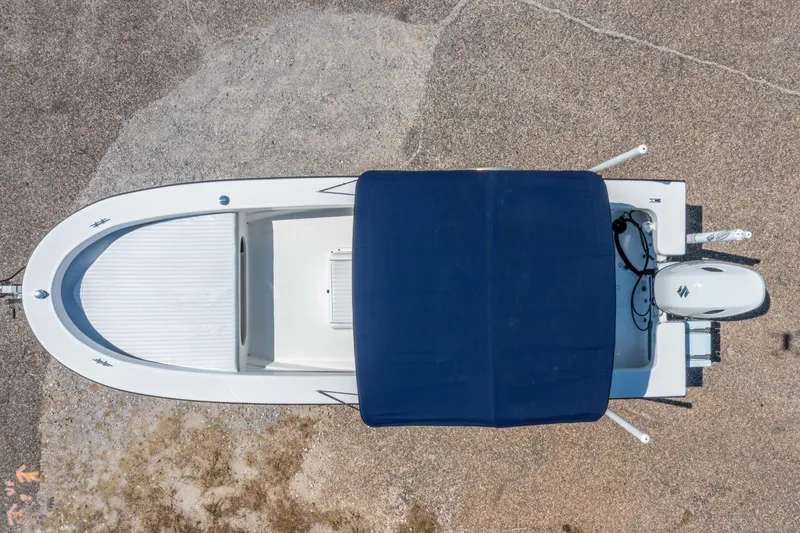 Slide: The Image of Overhead view of 2016 Panga 19 Niente boat with blue canopy and outboard motor. - 25