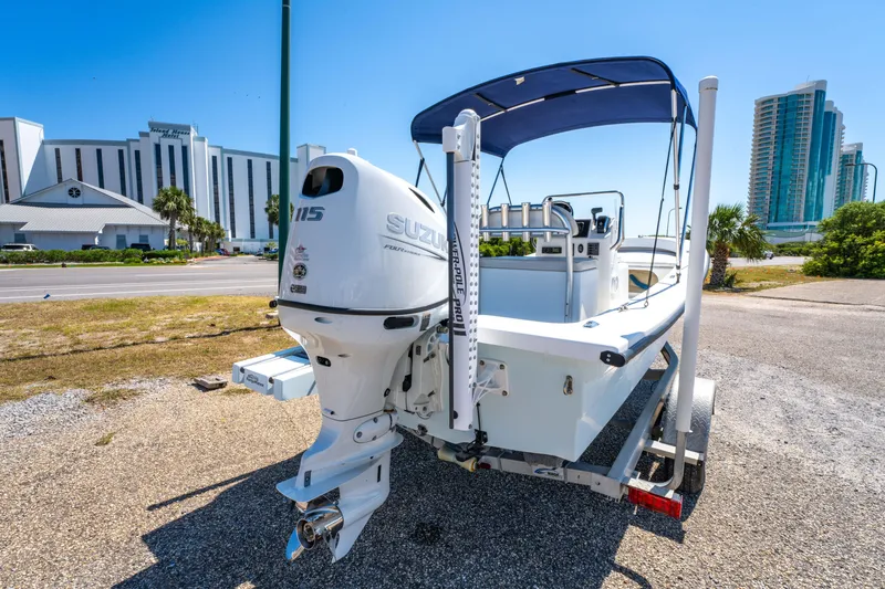 Slide: The Image of 2016 Panga 19 Niente boat with Suzuki outboard motor on trailer, urban background. - 5