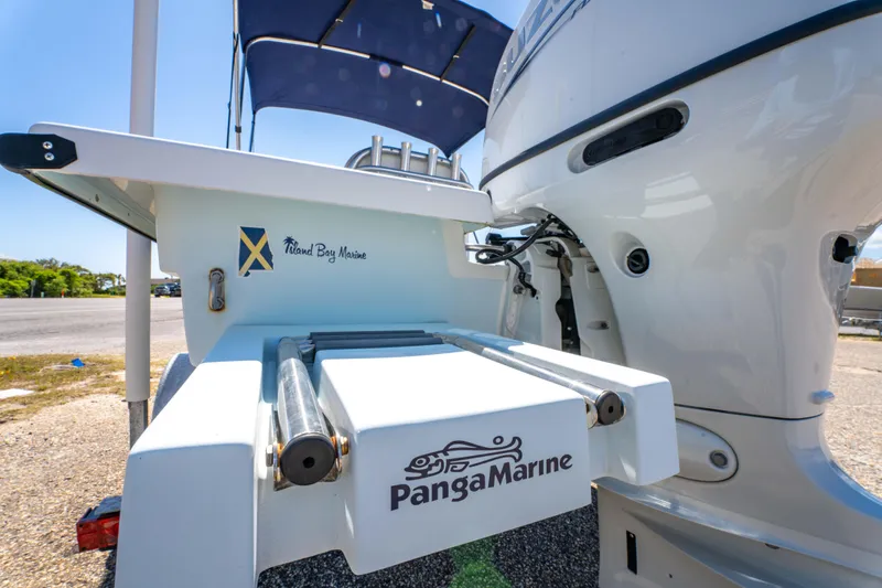 Slide: The Image of 2016 Panga 19 Niente boat with Panga Marine branding and outboard motor. - 9