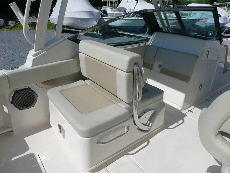Slide: The Image of 2022 Boston Whaler 240 Vantage boat interior with cushioned seating and sleek design. - 10