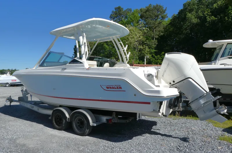 Slide: The Image of 2022 Boston Whaler 240 Vantage boat on trailer, parked outdoors. - 3