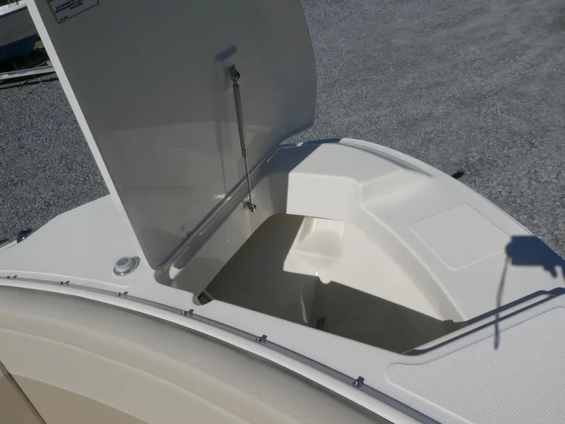 Slide: The Image of 2022 Boston Whaler 240 Vantage boat storage compartment open on deck. - 7