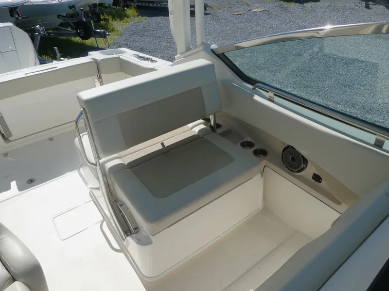 Slide: The Image of 2022 Boston Whaler 240 Vantage boat interior with seating and storage. - 8
