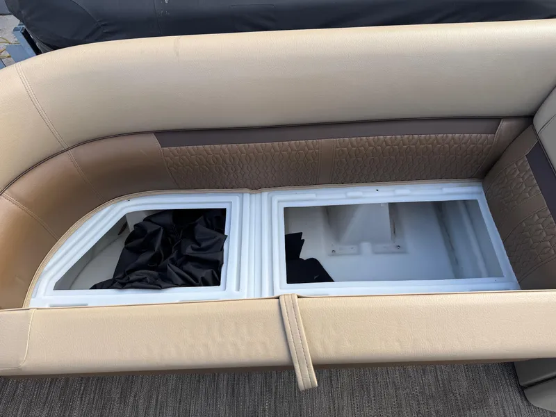 Slide: The Image of 2023 Godfrey SWEETWATER 2286 SB boat seating with storage compartments open. - 11