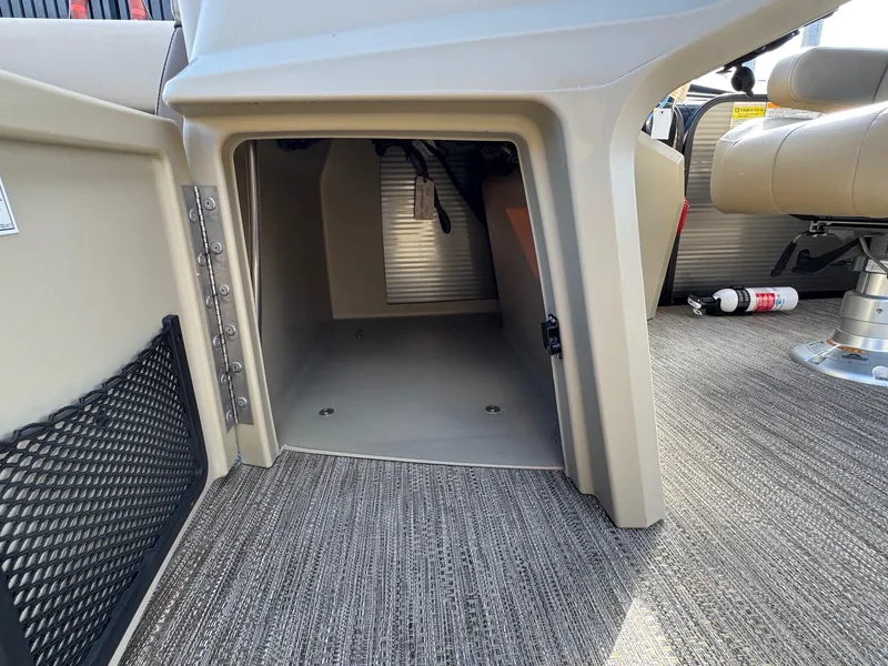 Slide: The Image of 2023 Godfrey SWEETWATER 2286 SB boat interior storage compartment with carpeted flooring. - 14
