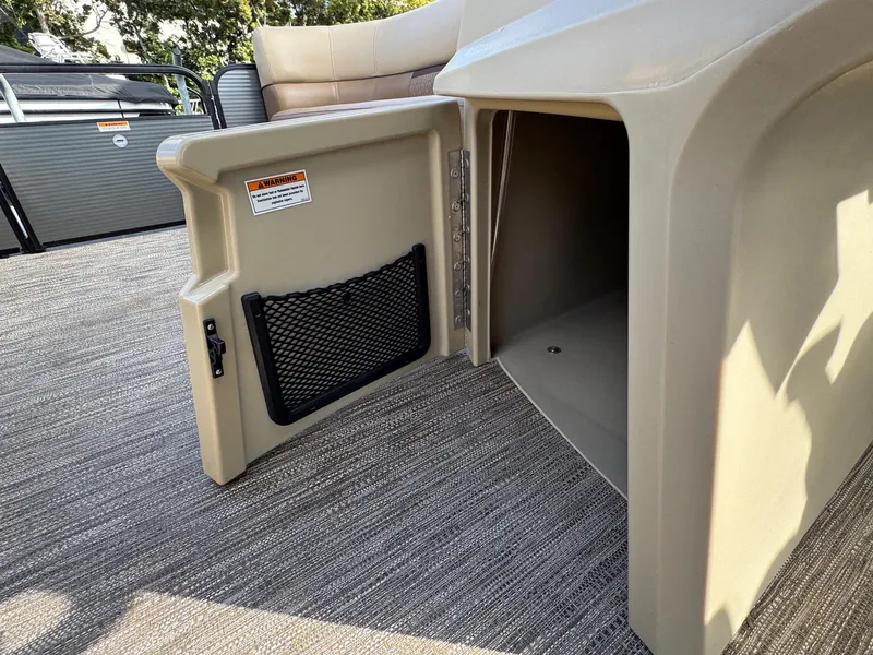 Slide: The Image of 2023 Godfrey SWEETWATER 2286 SB storage compartment with open door on boat deck. - 15