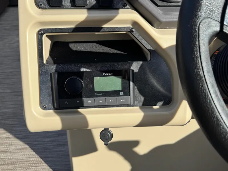 Slide: The Image of 2023 Godfrey SWEETWATER 2286 SB dashboard with Fusion audio system. - 20