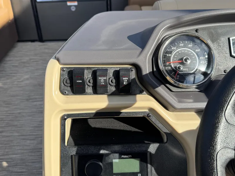 Slide: The Image of Control panel of 2023 Godfrey SWEETWATER 2286 SB boat with speedometer and switches. - 21