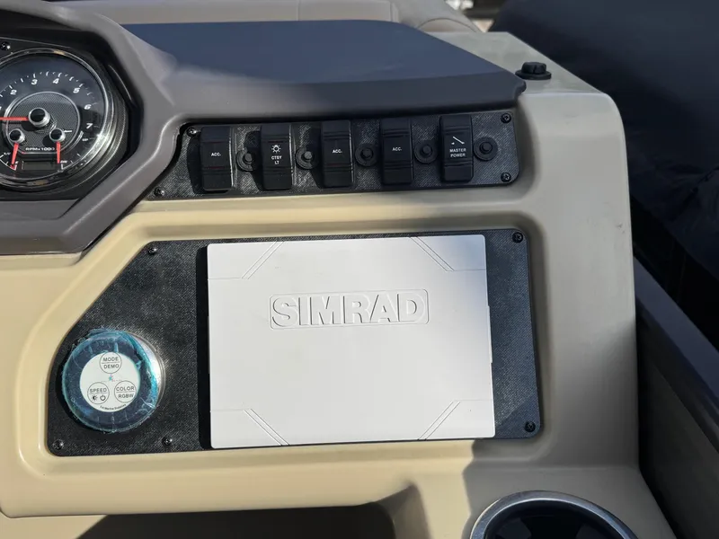 Slide: The Image of 2023 Godfrey SWEETWATER 2286 SB dashboard with Simrad display and control panel. - 22