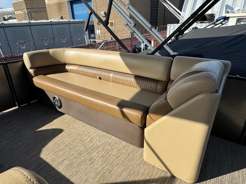 Slide: The Image of 2023 Godfrey SWEETWATER 2286 SB boat interior with beige seating and modern design. - 27