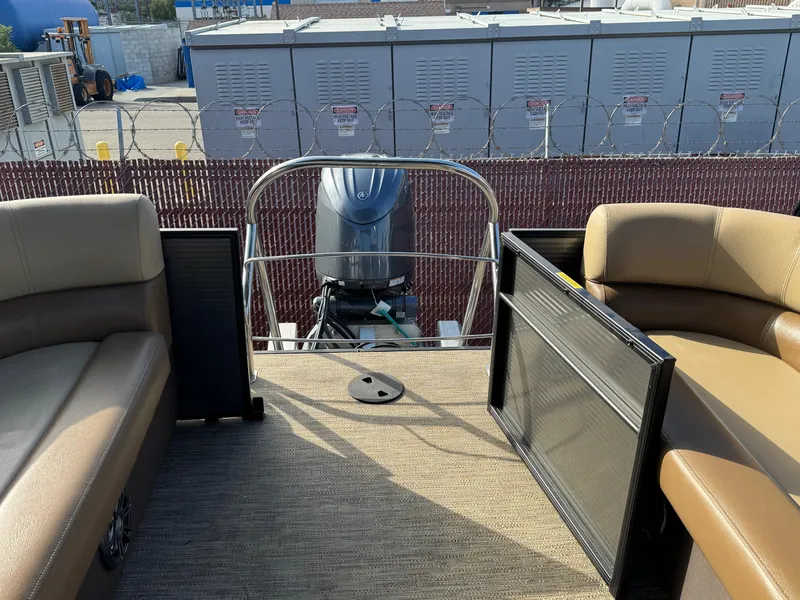 Slide: The Image of 2023 Godfrey SWEETWATER 2286 SB pontoon boat interior with seating and motor view. - 35