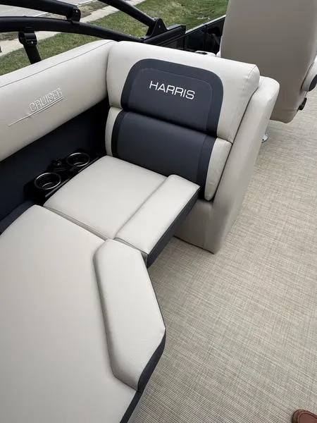 Slide: The Image of 2025 Harris Cruiser 230 boat interior with comfortable seating and cup holders. - 5