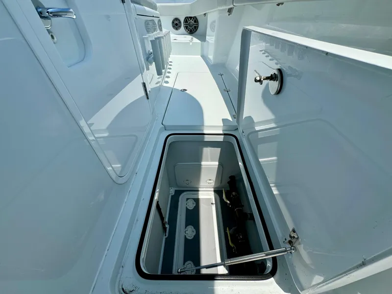 Slide: The Image of Open storage compartment on a 2024 Freeman 38 boat deck, showcasing spacious interior. - 27