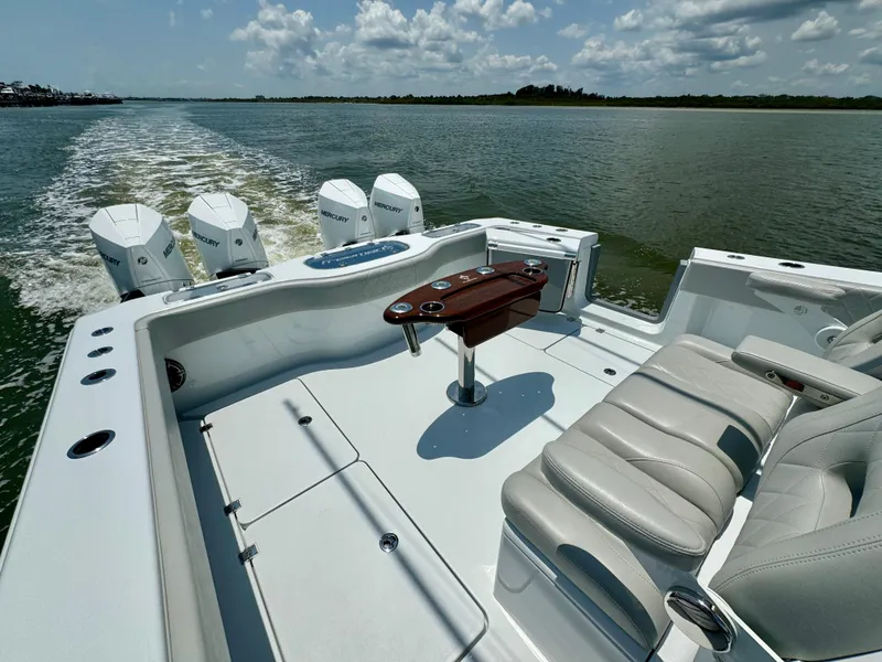 Slide: The Image of 2024 Freeman 38 boat with quad engines cruising on a sunny day. - 29