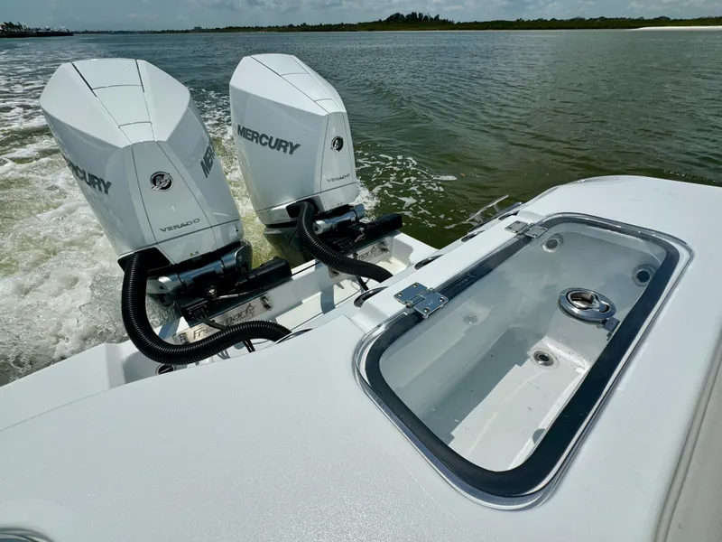 Slide: The Image of 2024 Freeman 38 boat with dual Mercury engines on open water. - 33