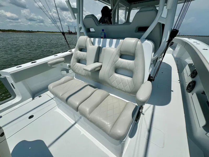 Slide: The Image of 2024 Freeman 38 boat with luxurious seating on a sunny day. - 38