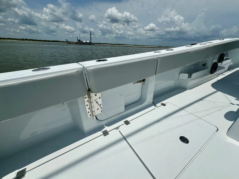 Slide: The Image of 2024 Freeman 38 boat deck with ocean view and cloudy sky. - 44