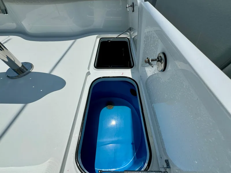 Slide: The Image of 2024 Freeman 38 boat deck with storage compartments and blue interior. - 46