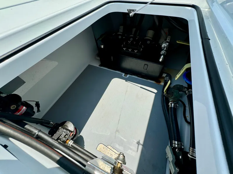 Slide: The Image of Engine compartment of 2024 Freeman 38 boat, showcasing mechanical components and wiring. - 47