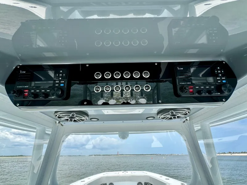 Slide: The Image of 2024 Freeman 38 boat dashboard with advanced controls and ocean view. - 49