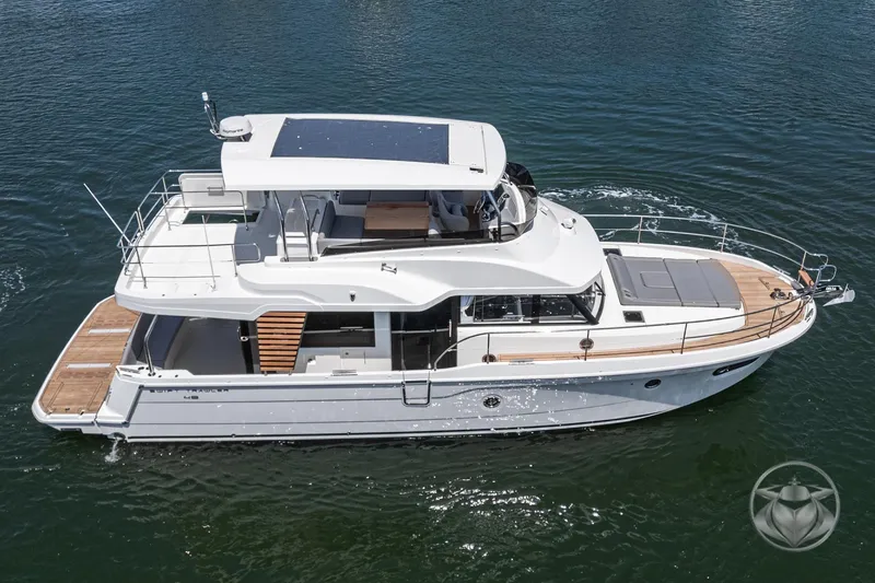 Slide: The Image of 2026 Beneteau Swift Trawler 48 cruising on calm waters, showcasing sleek design and spacious deck. - 21