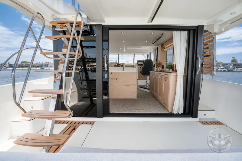 Slide: The Image of 2026 Beneteau Swift Trawler 48 interior with modern design and elegant staircase. - 34
