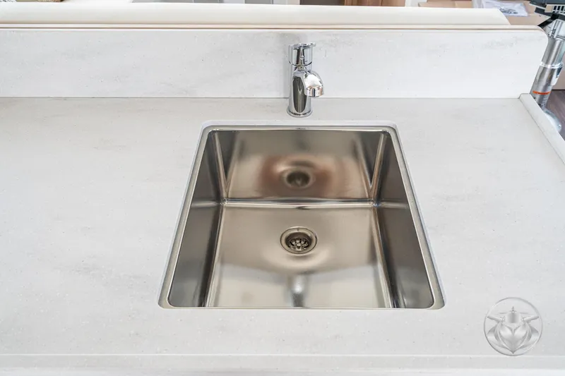 Slide: The Image of Stainless steel sink on Beneteau Swift Trawler 48, 2026 model, with modern faucet. - 38