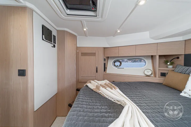 Slide: The Image of Luxurious cabin interior of 2026 Beneteau Swift Trawler 48 with modern design elements. - 53