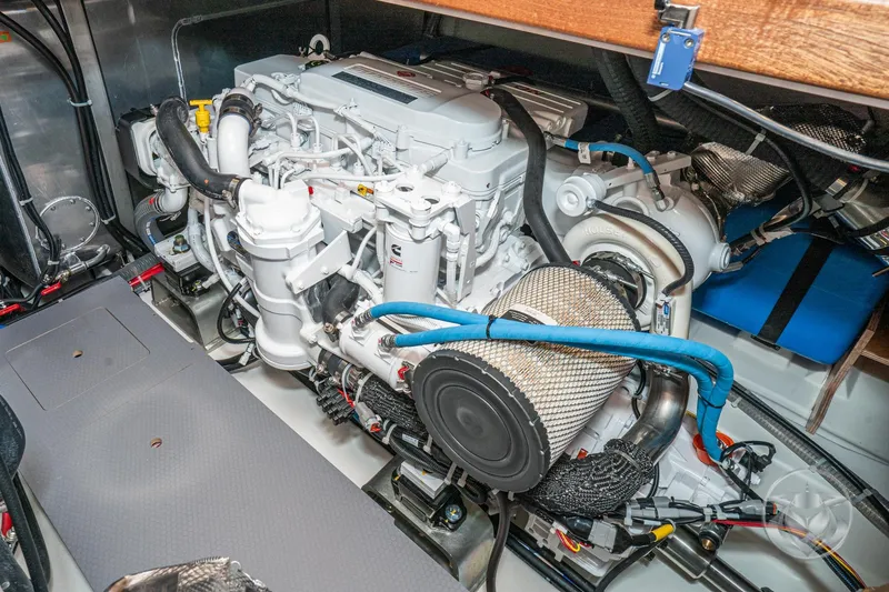 Slide: The Image of Engine room of 2026 Beneteau Swift Trawler 48, showcasing detailed mechanical components. - 63