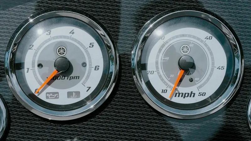 Slide: The Image of Dashboard gauges of 2025 G3 SunCatcher Select 20 Cruise boat, showing RPM and speed. - 1