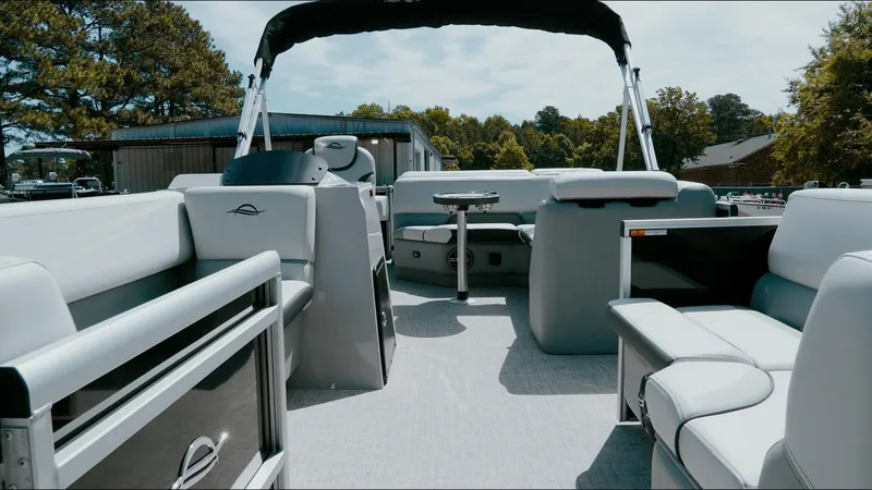 Slide: The Image of 2025 G3 SunCatcher Select 20 Cruise pontoon boat interior with seating and helm. - 12