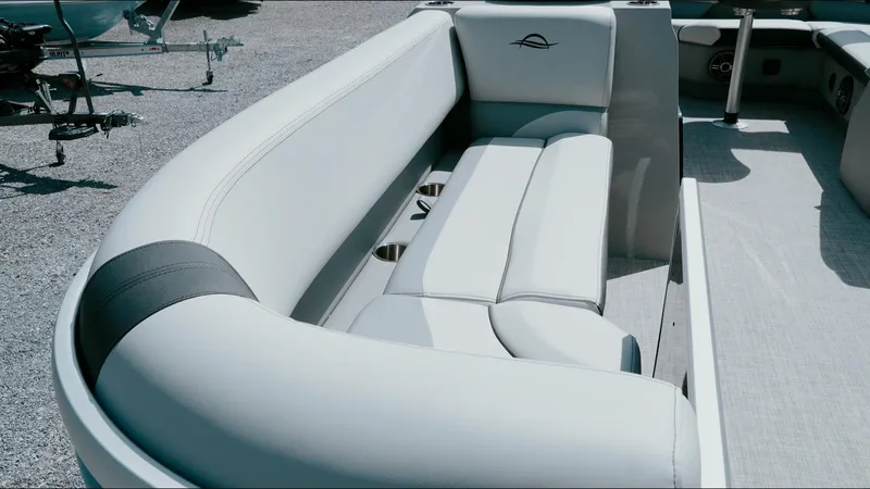 Slide: The Image of 2025 G3 SunCatcher Select 20 Cruise boat interior with plush seating and cup holders. - 14