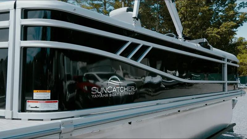 Slide: The Image of 2025 G3 SunCatcher Select 20 Cruise pontoon boat, sleek black exterior, side view. - 15