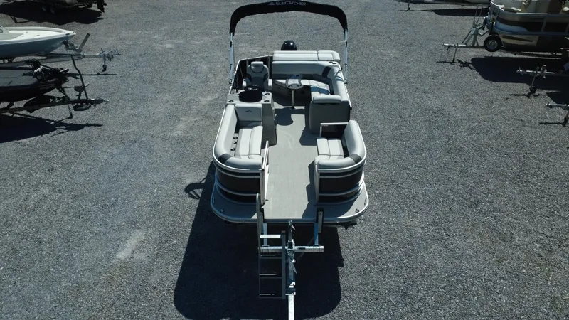 Slide: The Image of 2025 G3 SunCatcher Select 20 Cruise pontoon boat on gravel lot, aerial view. - 26