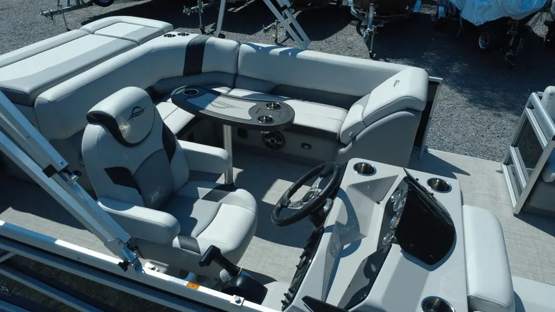 Slide: The Image of 2025 G3 SunCatcher Select 20 Cruise boat interior with plush seating and modern helm. - 29