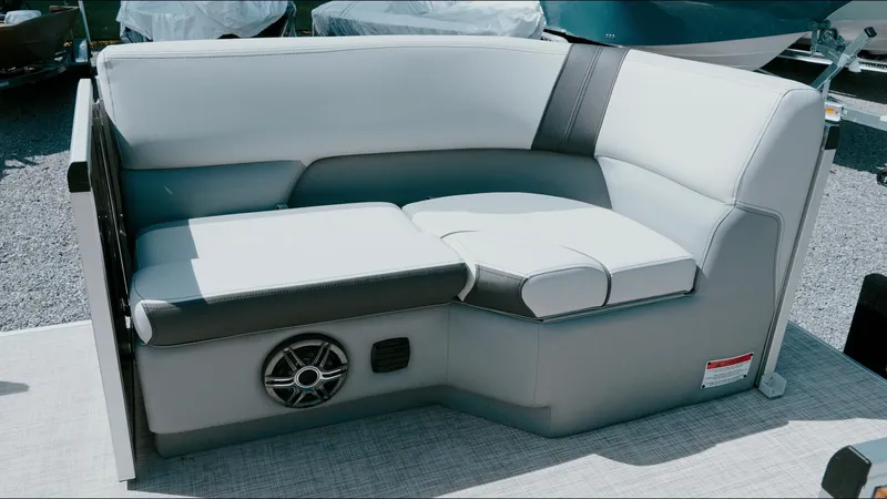 Slide: The Image of 2025 G3 SunCatcher Select 20 Cruise boat seating with speaker, gray upholstery, and modern design. - 4